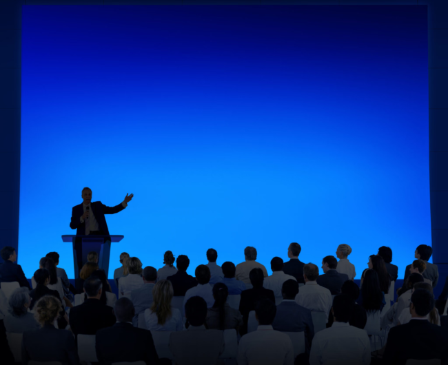 Group-Of-Business-People-Listening-To-A-Speech-2048×1671